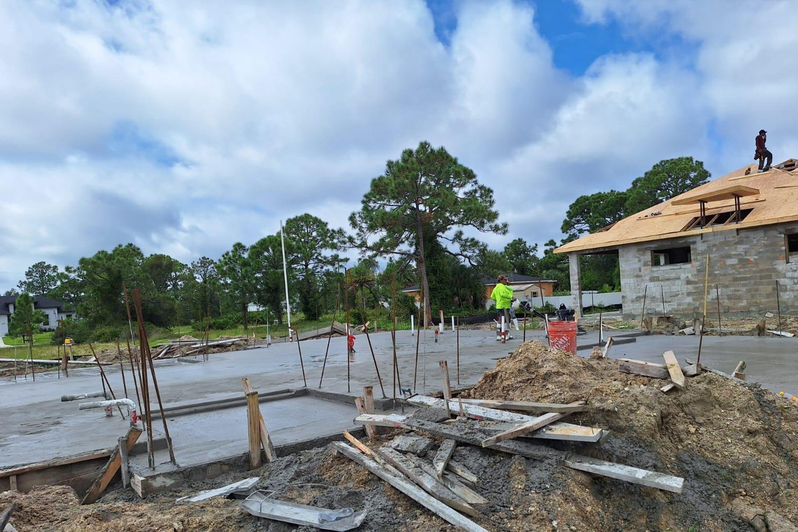 Concrete services in swfl. man working on a floor slab for a residential property.